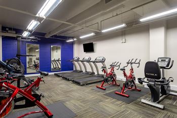 a gym with cardio bikes and other exercise equipment at 500 Fifth Apartments, Nashville, Tennessee